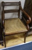 A caned Regency carver chair