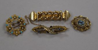 A late Victorian 15ct gold, sapphire and seed pearl bar brooch, a 10ct gold gem set brooch and two