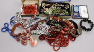 A collection of beads including coral and mixed costume jewellery.