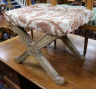 An 18th century upholstered gilt X-frame stool W.57cm.