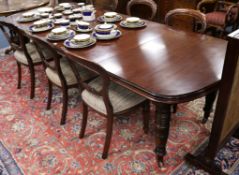An Edwardian mahogany extending dining table W.270cm. (fully extended)