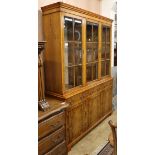 A George III style yew display cabinet on cupboard W.151cm