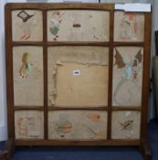 A Cotswolds School fruitwood fire screen with panels of hand embroidery scenes from Alice in