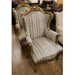 A pair of Louis XVI style gilt fauteuils
