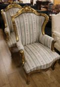 A pair of Louis XVI style gilt fauteuils