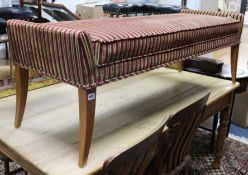 A long stool with Regency striped upholstery W.150cm.