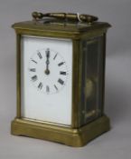 A French gilt brass carriage clock, having white enamelled Roman dial and striking on gong, H 13.