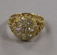 A Victorian style 18ct gold and old mine cut diamond set dress ring, size R.