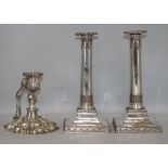 A pair of 19th century silver plated candlesticks and a rococco style chamberstick with swing