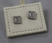 A pair of modern 18ct white gold and diamond cluster tablet ear studs with central princess cut