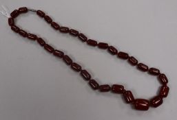 A single strand simulated cherry amber necklace, gross weight 49 grams, 56cm.