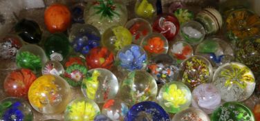 A collection of glass paperweights