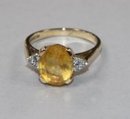 A 9ct gold, citrine and diamond set dress ring, size N.