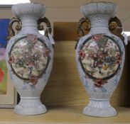 A pair of modern Satsuma large two-handled vases, polychrome-decorated with figures and flowers in