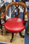 A Victorian mahogany revolving desk chair