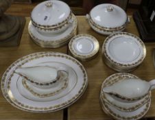 A Wedgwood Whitehall pattern dinner service, setting for eight, decorated with gilt vineous