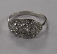 A modern 1920's/1930's style 18ct white gold and diamond cluster dress ring, size N.