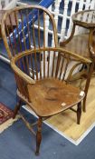 An early 19th century elm and ash stickback kitchen elbow chair (cut down)