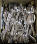 A quantity of assorted silver plated cutlery including rat tail pattern flatware and carving set.