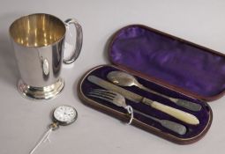 A silver Christening set, comprising knife, fork and spoon, a plated mug and a silver open face