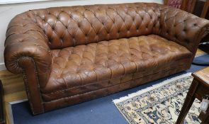 A button back leather Chesterfield settee W.210cm.