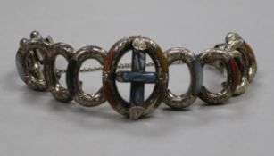 A late Victorian engraved silver and inset Scottish hardstone oval link bracelet.