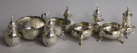 A collection of silver condiments, etc., including a pair of cauldron salts with hoof feet, a