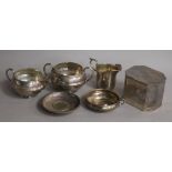 A George V silver sugar bowl and cream jug, a silver dish by A.E. Jones and three other items