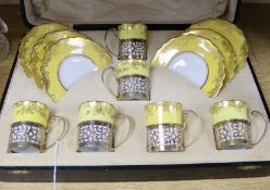An Aynsley yellow and gilt coffee set with plated mounts, cased