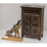 A spelter cherub group and a miniature armoire height 23cm cabinet height 36cm width 24cm