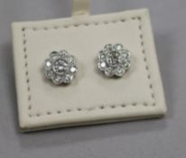 A modern pair of 18ct white gold and diamond cluster flower head ear studs, 9mm.