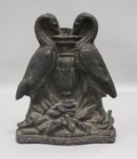 A Victorian cast iron door stop modelled as two cranes height 20cm