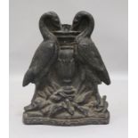 A Victorian cast iron door stop modelled as two cranes height 20cm