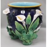 A George Jones majolica jardiniere, applied with calla lilies and swallows on a cobalt blue