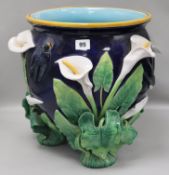 A George Jones majolica jardiniere, applied with calla lilies and swallows on a cobalt blue