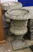 A pair of reconstituted stone campana-shaped urns, W.43cm H.66cm