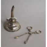 A George III Irish silver wine funnel, Dublin, 1818? and a pair of mid 18th century silver sugar