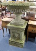 A reconstituted stone large urn on square plinth W.82cm.