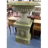 A reconstituted stone large urn on square plinth W.82cm.