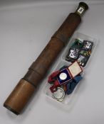 A three draw telescope by Ottway and a quantity of mixed military badges and medals