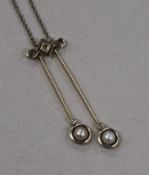 An early 20th century, yellow metal, diamond and split pearl set double drop pendant necklace,