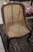 A mid Victorian mahogany caned spoonback chair
