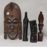 A carved tribal mask and three carvings mask height 40cm