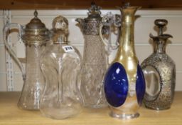 A dimple decanter with silver mount, two claret jugs with plated mounts and two other items