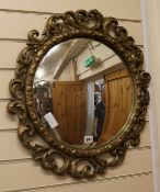 A gilt framed convex wall mirror W.56cm