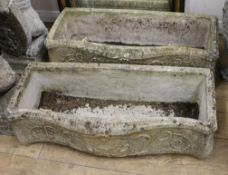 A pair of serpentine-fronted reconstituted stone rectangular planters, L 74cm