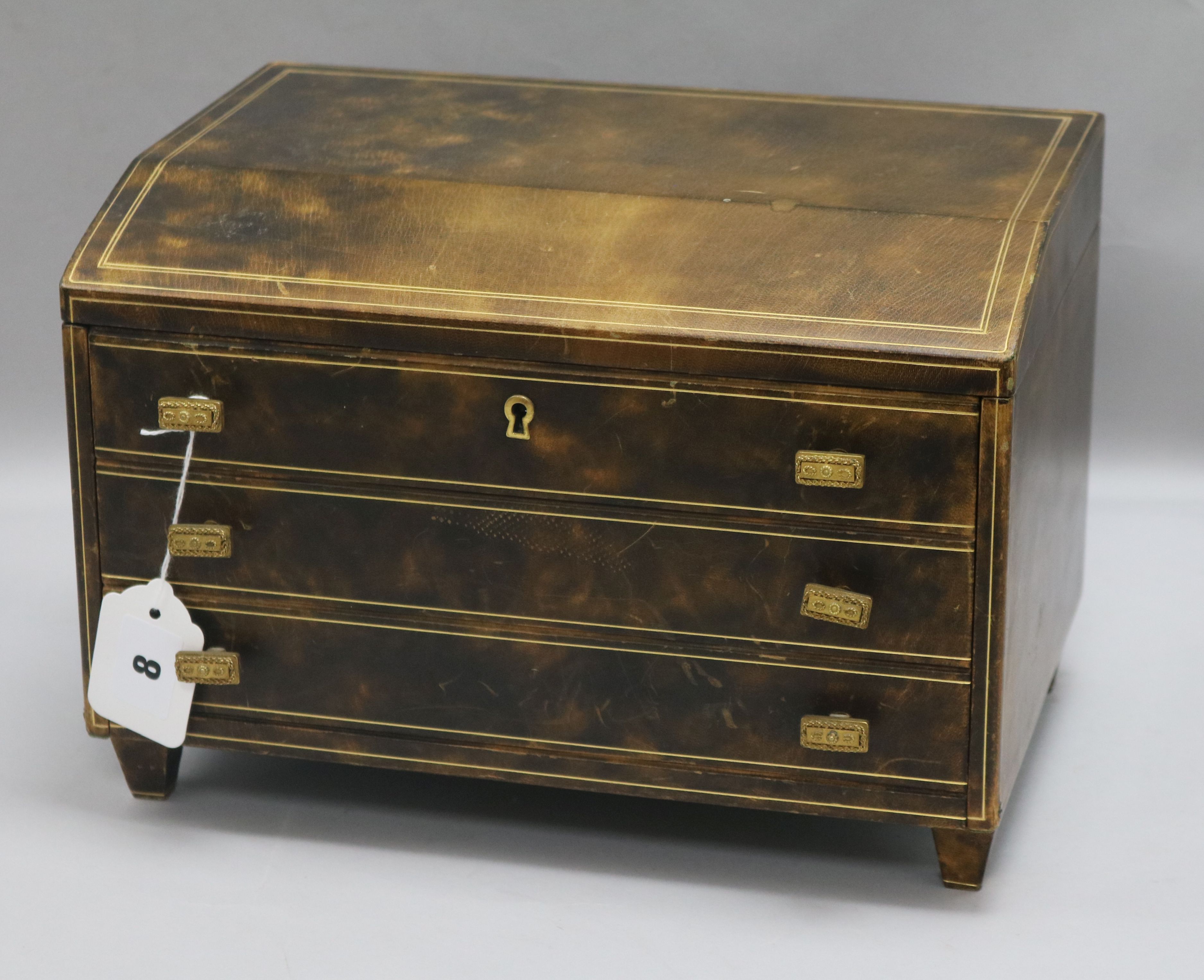 A Liberty's gilt line-inlaid leather-covered jewellery cabinet, having hinged cover and fall flap