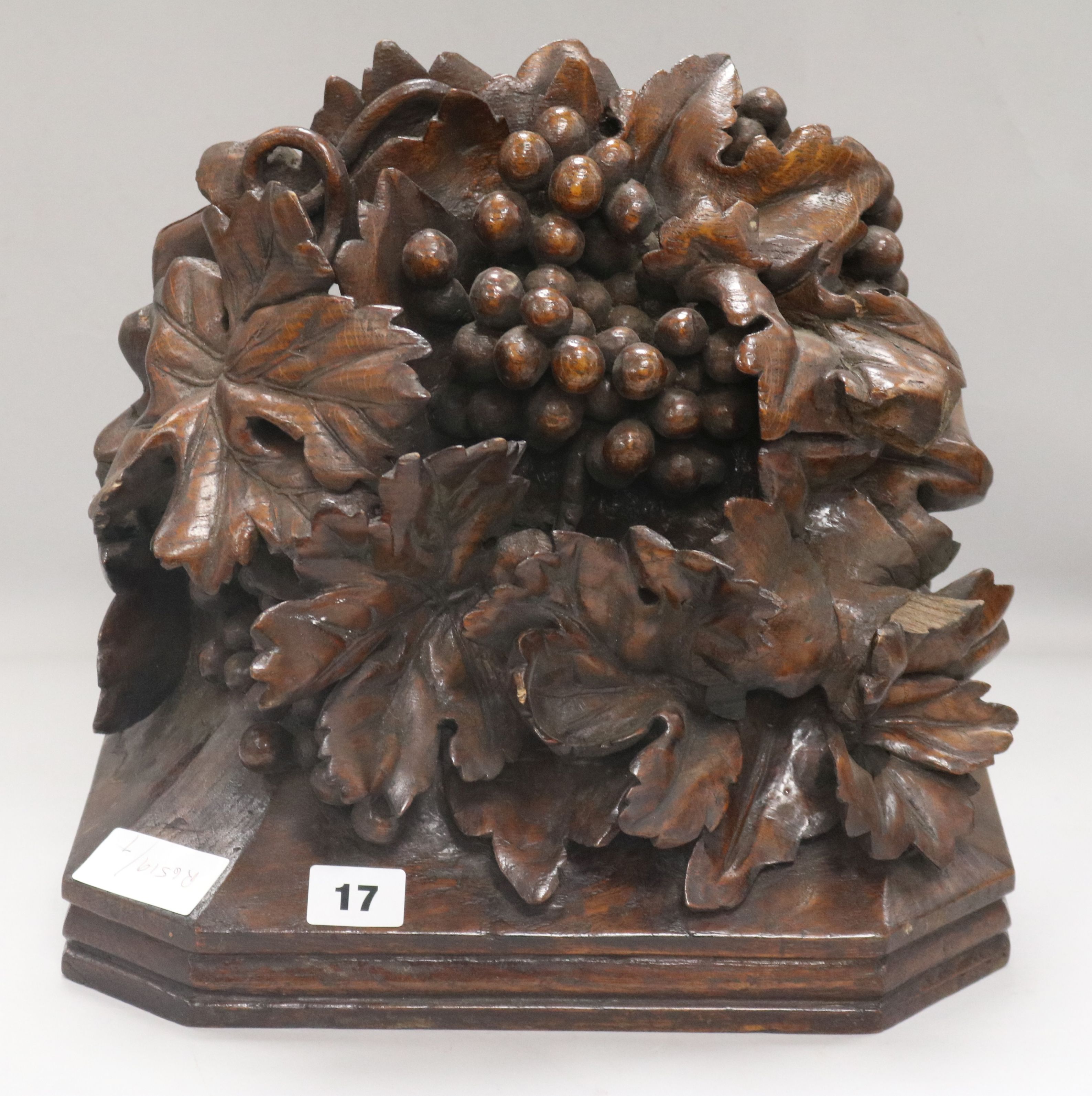 An oak carved wall bracket of fruit, 1880, carved by Harry Fletcher