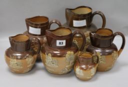 Six graduated Doulton jugs