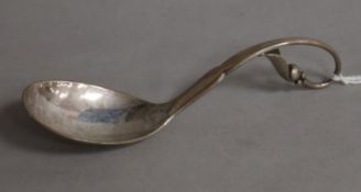 A late 1920's Georg Jensen Danish sterling silver preserve spoon, no. 21, with leaf and berry